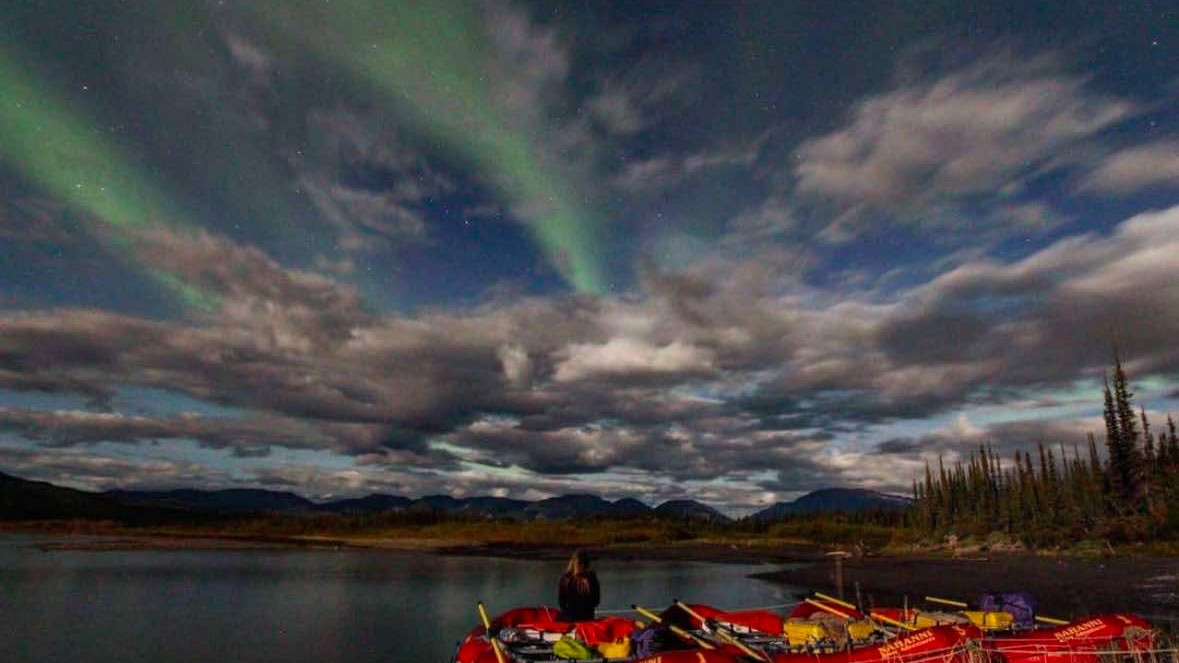 Aurora over a northern river — the place where water risk and value first meet.